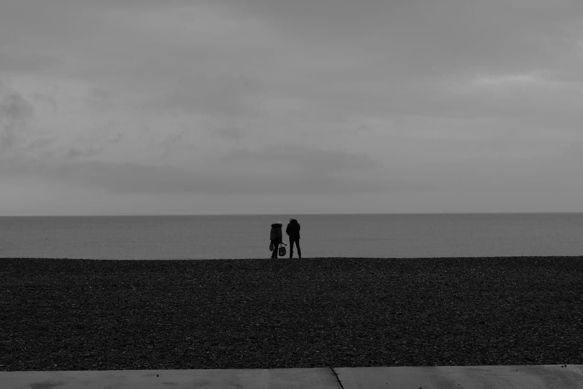 A couple on the beach in Dieppe Normandy