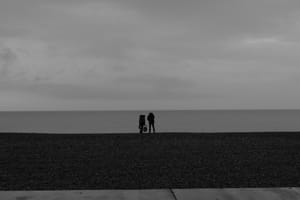A couple on the beach in Dieppe Normandy